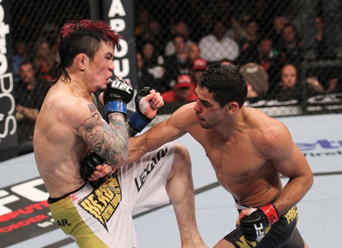 LAS VEGAS, NV - FEBRUARY 04: Renan Barao (right) punches Scott Jorgensen during the UFC 143 event at Mandalay Bay Events Center on February 4, 2012 in Las Vegas, Nevada. (Photo by Nick Laham/Zuffa LLC/Zuffa LLC via Getty Images) *** Local Caption *** Re