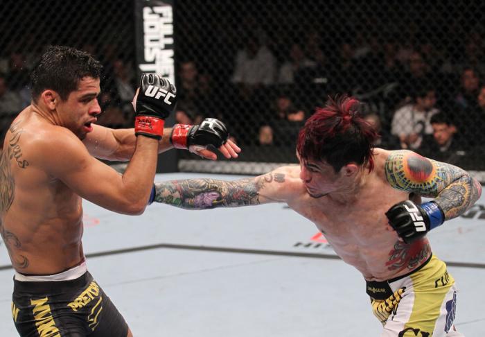 LAS VEGAS, NV - FEBRUARY 04: Scott Jorgensen (right) punches Renan Barao during the UFC 143 event at Mandalay Bay Events Center on February 4, 2012 in Las Vegas, Nevada. (Photo by Nick Laham/Zuffa LLC/Zuffa LLC via Getty Images) *** Local Caption *** Sc