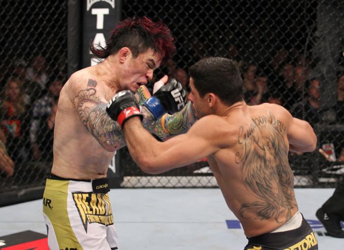 LAS VEGAS, NV - FEBRUARY 04: Renan Barao (right) punches Scott Jorgensen during the UFC 143 event at Mandalay Bay Events Center on February 4, 2012 in Las Vegas, Nevada. (Photo by Nick Laham/Zuffa LLC/Zuffa LLC via Getty Images) *** Local Caption *** Re