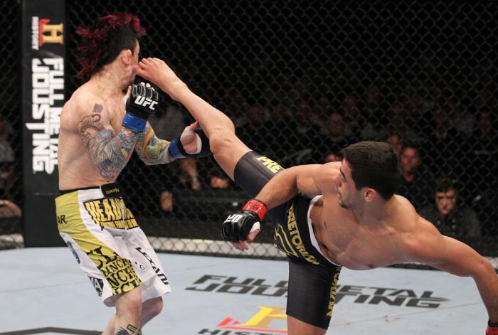 LAS VEGAS, NV - FEBRUARY 04: Renan Barao (right) kicks Scott Jorgensen during the UFC 143 event at Mandalay Bay Events Center on February 4, 2012 in Las Vegas, Nevada. (Photo by Nick Laham/Zuffa LLC/Zuffa LLC via Getty Images) *** Local Caption *** Rena