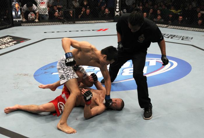 TORONTO, ON - DECEMBER 10: (L-R) "The Korean Zombie" Chan Sung Jung defeats Mark Hominick by knockout during the UFC 140 event at Air Canada Centre on December 10, 2011 in Toronto, Ontario, Canada. (Photo by Nick Laham/Zuffa LLC/Zuffa LLC via Getty Images