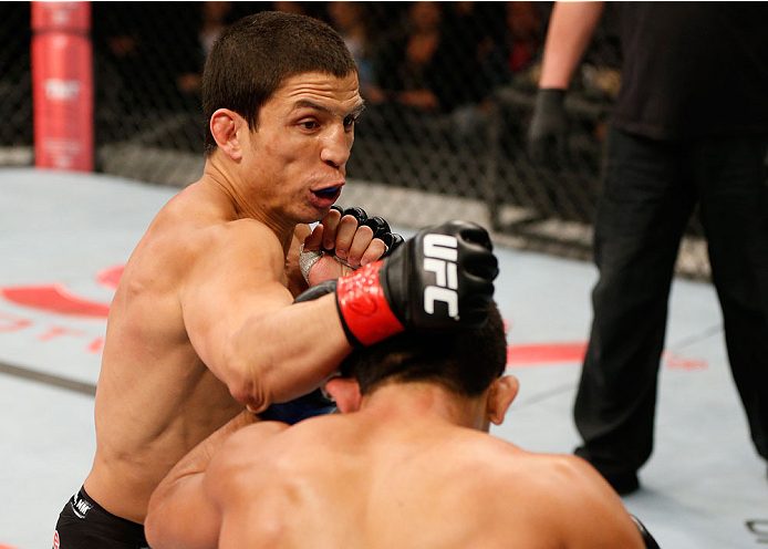BELO HORIZONTE, BRAZIL - SEPTEMBER 04: (L-R) Joseph Benavidez punches Jussier Formiga in the flyweight fight during the UFC on FOX Sports 1 event at Mineirinho Arena on September 4, 2013 in Belo Horizonte, Brazil. (Photo by Josh Hedges/Zuffa LLC/Zuffa LL
