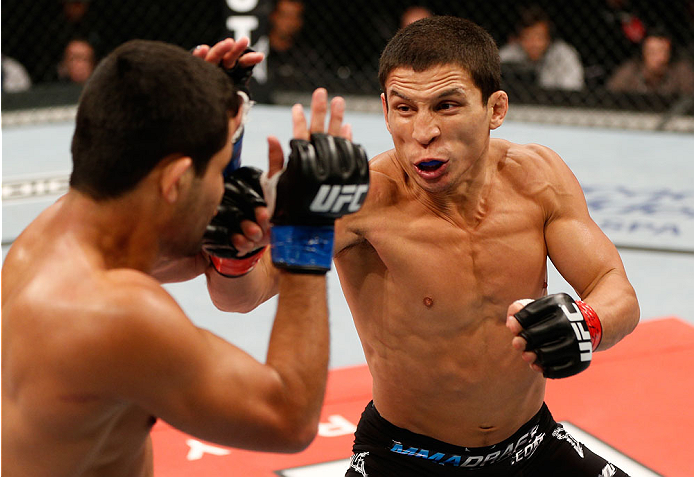 BELO HORIZONTE, BRAZIL - SEPTEMBER 04: (R-L) Joseph Benavidez punches Jussier Formiga in the flyweight fight during the UFC on FOX Sports 1 event at Mineirinho Arena on September 4, 2013 in Belo Horizonte, Brazil. (Photo by Josh Hedges/Zuffa LLC/Zuffa LL