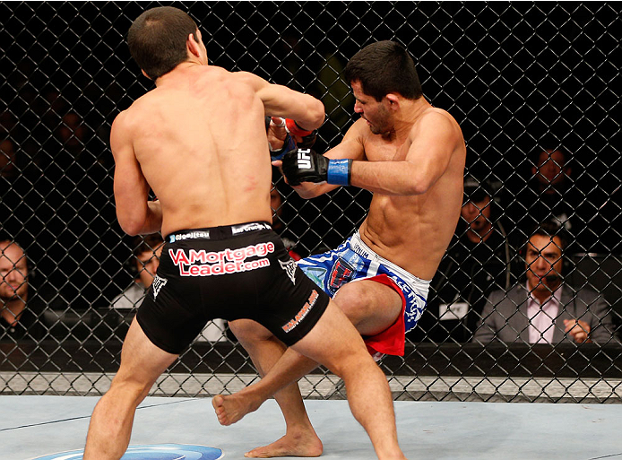 BELO HORIZONTE, BRAZIL - SEPTEMBER 04: (L-R) Joseph Benavidez knocks down Jussier Formiga with a punch in the flyweight fight during the UFC on FOX Sports 1 event at Mineirinho Arena on September 4, 2013 in Belo Horizonte, Brazil. (Photo by Josh Hedges/Z
