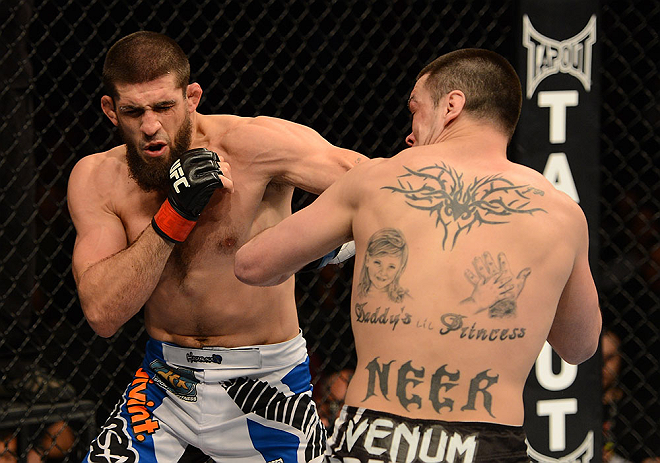 ANAHEIM, CA - FEBRUARY 23: (L-R) Court McGee punches Josh Neer in their welterweight bout during UFC 157 at Honda Center on February 23, 2013 in Anaheim, California. (Photo by Donald Miralle/Zuffa LLC/Zuffa LLC via Getty Images) *** Local Caption *** Co