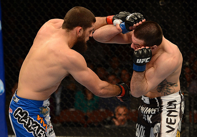 ANAHEIM, CA - FEBRUARY 23: (L-R) Court McGee punches Josh Neer in their welterweight bout during UFC 157 at Honda Center on February 23, 2013 in Anaheim, California. (Photo by Donald Miralle/Zuffa LLC/Zuffa LLC via Getty Images) *** Local Caption *** Co