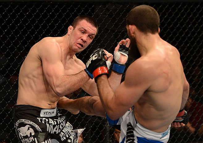 ANAHEIM, CA - FEBRUARY 23: (R-L) Court McGee kicks Josh Neer in their welterweight bout during UFC 157 at Honda Center on February 23, 2013 in Anaheim, California. (Photo by Donald Miralle/Zuffa LLC/Zuffa LLC via Getty Images) *** Local Caption *** Cour