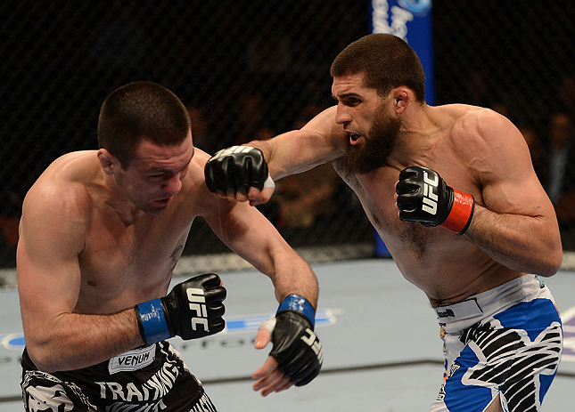 ANAHEIM, CA - FEBRUARY 23: (R-L) Court McGee punches Josh Neer in their welterweight bout during UFC 157 at Honda Center on February 23, 2013 in Anaheim, California. (Photo by Donald Miralle/Zuffa LLC/Zuffa LLC via Getty Images) *** Local Caption *** Co