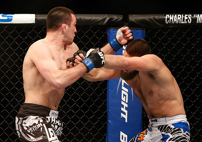 ANAHEIM, CA - FEBRUARY 23: (L-R) Josh Neer punches Court McGee in their welterweight bout during UFC 157 at Honda Center on February 23, 2013 in Anaheim, California. (Photo by Josh Hedges/Zuffa LLC/Zuffa LLC via Getty Images) *** Local Caption *** Court