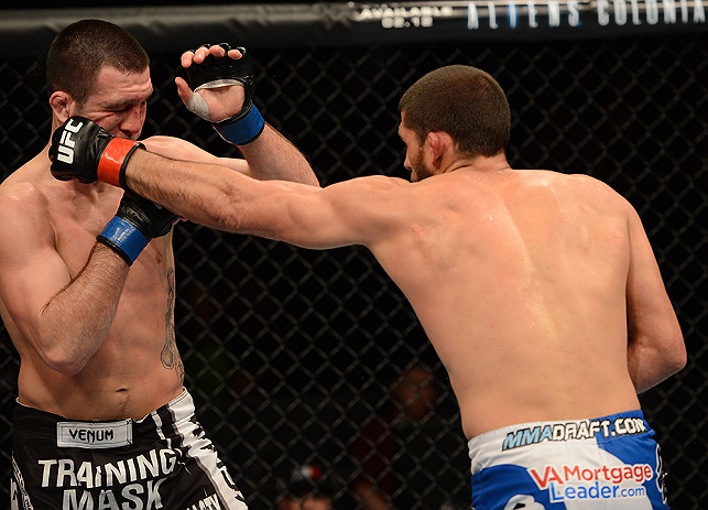 ANAHEIM, CA - FEBRUARY 23: (R-L) Court McGee punches Josh Neer in their welterweight bout during UFC 157 at Honda Center on February 23, 2013 in Anaheim, California. (Photo by Donald Miralle/Zuffa LLC/Zuffa LLC via Getty Images) *** Local Caption *** Co