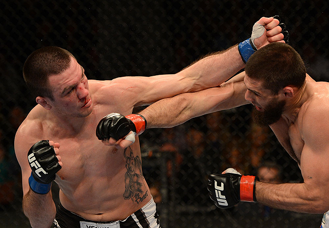 ANAHEIM, CA - FEBRUARY 23: (L-R) Josh Neer punches Court McGee in their welterweight bout during UFC 157 at Honda Center on February 23, 2013 in Anaheim, California. (Photo by Donald Miralle/Zuffa LLC/Zuffa LLC via Getty Images) *** Local Caption *** Co