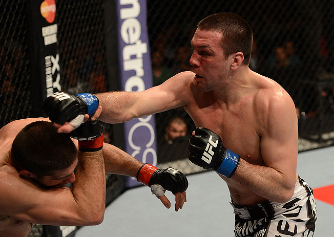 ANAHEIM, CA - FEBRUARY 23: (R-L) Josh Neer punches Court McGee in their welterweight bout during UFC 157 at Honda Center on February 23, 2013 in Anaheim, California. (Photo by Donald Miralle/Zuffa LLC/Zuffa LLC via Getty Images) *** Local Caption *** Co