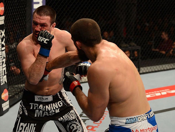 ANAHEIM, CA - FEBRUARY 23: (R-L) Court McGee punches Josh Neer in their welterweight bout during UFC 157 at Honda Center on February 23, 2013 in Anaheim, California. (Photo by Donald Miralle/Zuffa LLC/Zuffa LLC via Getty Images) *** Local Caption *** Co