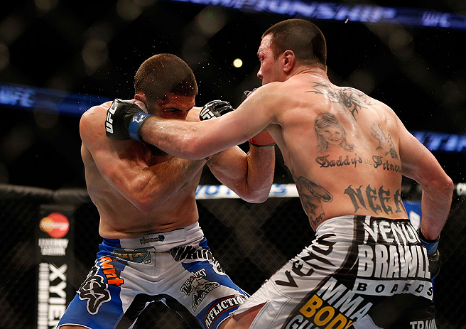 ANAHEIM, CA - FEBRUARY 23: (R-L) Josh Neer punches Court McGee in their welterweight bout during UFC 157 at Honda Center on February 23, 2013 in Anaheim, California. (Photo by Josh Hedges/Zuffa LLC/Zuffa LLC via Getty Images) *** Local Caption *** Court