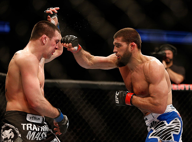 ANAHEIM, CA - FEBRUARY 23: (R-L) Court McGee punches Josh Neer in their welterweight bout during UFC 157 at Honda Center on February 23, 2013 in Anaheim, California. (Photo by Josh Hedges/Zuffa LLC/Zuffa LLC via Getty Images) *** Local Caption *** Court