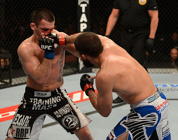ANAHEIM, CA - FEBRUARY 23: (R-L) Court McGee punches Josh Neer in their welterweight bout during UFC 157 at Honda Center on February 23, 2013 in Anaheim, California. (Photo by Donald Miralle/Zuffa LLC/Zuffa LLC via Getty Images) *** Local Caption *** Co