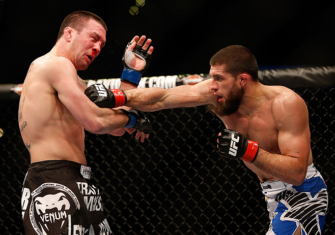 ANAHEIM, CA - FEBRUARY 23: (R-L) Court McGee punches Josh Neer in their welterweight bout during UFC 157 at Honda Center on February 23, 2013 in Anaheim, California. (Photo by Josh Hedges/Zuffa LLC/Zuffa LLC via Getty Images) *** Local Caption *** Court