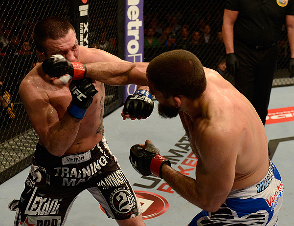 ANAHEIM, CA - FEBRUARY 23: (R-L) Court McGee punches Josh Neer in their welterweight bout during UFC 157 at Honda Center on February 23, 2013 in Anaheim, California. (Photo by Donald Miralle/Zuffa LLC/Zuffa LLC via Getty Images) *** Local Caption *** Co