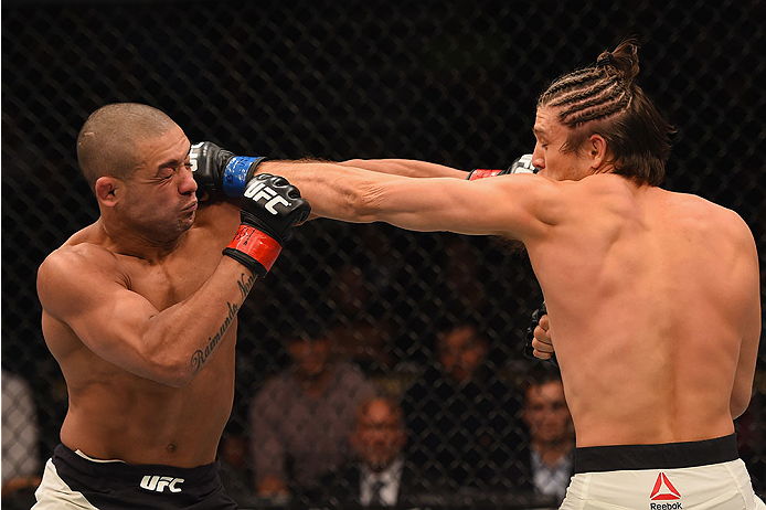 LAS VEGAS, NV - JANUARY 02: (R-L) Brian Ortega punches Diego Brandao of Brazil in their featherweight bout during the UFC 195 event inside MGM Grand Garden Arena on January 2, 2016 in Las Vegas, Nevada. (Photo by Josh Hedges/Zuffa LLC/Zuffa LLC via Getty