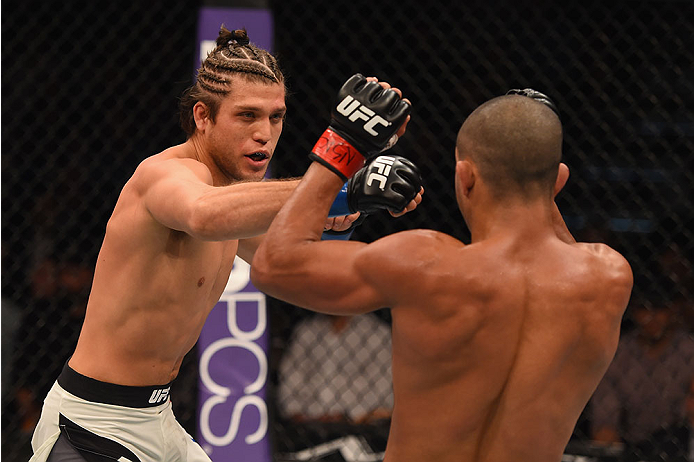 LAS VEGAS, NV - JANUARY 02: (L-R) Brian Ortega punches Diego Brandao of Brazil in their featherweight bout during the UFC 195 event inside MGM Grand Garden Arena on January 2, 2016 in Las Vegas, Nevada. (Photo by Josh Hedges/Zuffa LLC/Zuffa LLC via Getty