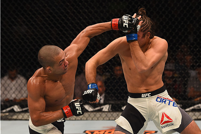 LAS VEGAS, NV - JANUARY 02: (L-R) Diego Brandao of Brazil punches Brian Ortega in their featherweight bout during the UFC 195 event inside MGM Grand Garden Arena on January 2, 2016 in Las Vegas, Nevada. (Photo by Josh Hedges/Zuffa LLC/Zuffa LLC via Getty