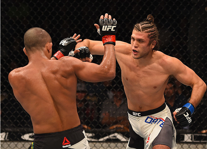 LAS VEGAS, NV - JANUARY 02: (R-L) Brian Ortega punches Diego Brandao of Brazil in their featherweight bout during the UFC 195 event inside MGM Grand Garden Arena on January 2, 2016 in Las Vegas, Nevada. (Photo by Josh Hedges/Zuffa LLC/Zuffa LLC via Getty