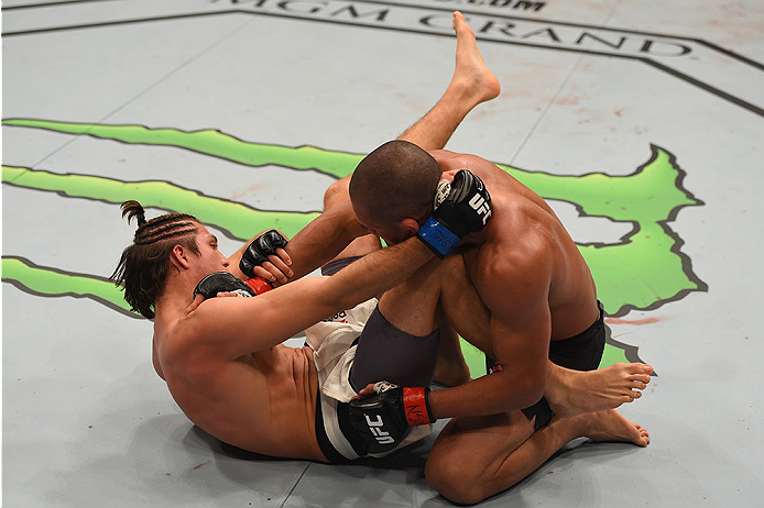 LAS VEGAS, NV - JANUARY 02: (L-R) Brian Ortega attempts to submit Diego Brandao of Brazil in their featherweight bout during the UFC 195 event inside MGM Grand Garden Arena on January 2, 2016 in Las Vegas, Nevada. (Photo by Josh Hedges/Zuffa LLC/Zuffa LL
