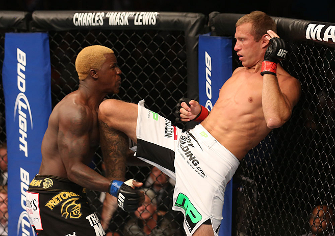 DENVER, CO - AUGUST 11: (R-L) Donald "Cowboy" Cerrone delivers a knee strike against Melvin Guillard during their lightweight bout at UFC 150 inside Pepsi Center on August 11, 2012 in Denver, Colorado. (Photo by Nick Laham/Zuffa LLC/Zuffa LLC via Getty I