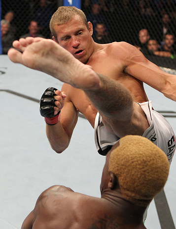 DENVER, CO - AUGUST 11: (L-R) Donald "Cowboy" Cerrone kicks Melvin Guillard during their lightweight bout at UFC 150 inside Pepsi Center on August 11, 2012 in Denver, Colorado. (Photo by Josh Hedges/Zuffa LLC/Zuffa LLC via Getty Images)