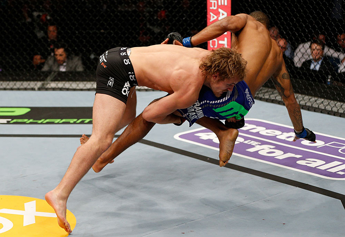 LONDON, ENGLAND - FEBRUARY 16: (L-R) Gunnar Nelson takes down Jorge Santiago in their welterweight fight during the UFC on Fuel TV event on February 16, 2013 at Wembley Arena in London, England. (Photo by Josh Hedges/Zuffa LLC/Zuffa LLC via Getty Images
