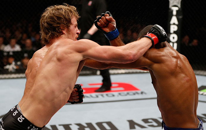 LONDON, ENGLAND - FEBRUARY 16: (L-R) Gunnar Nelson punches Jorge Santiago in their welterweight fight during the UFC on Fuel TV event on February 16, 2013 at Wembley Arena in London, England. (Photo by Josh Hedges/Zuffa LLC/Zuffa LLC via Getty Images)