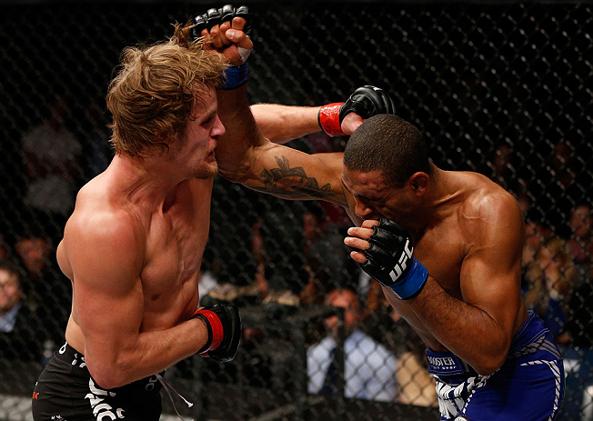 LONDON, ENGLAND - FEBRUARY 16: (L-R) Gunnar Nelson punches Jorge Santiago in their welterweight fight during the UFC on Fuel TV event on February 16, 2013 at Wembley Arena in London, England. (Photo by Josh Hedges/Zuffa LLC/Zuffa LLC via Getty Images)