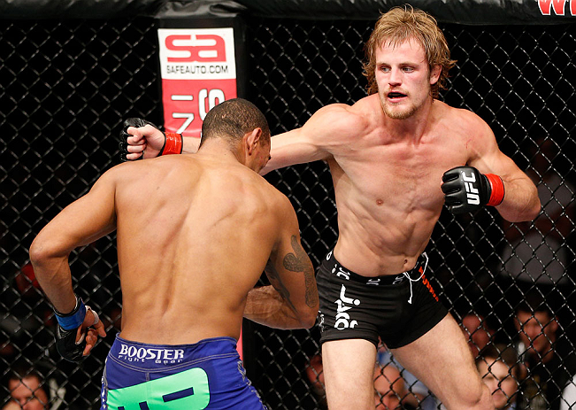 LONDON, ENGLAND - FEBRUARY 16: (R-L) Gunnar Nelson punches Jorge Santiago in their welterweight fight during the UFC on Fuel TV event on February 16, 2013 at Wembley Arena in London, England. (Photo by Josh Hedges/Zuffa LLC/Zuffa LLC via Getty Images)