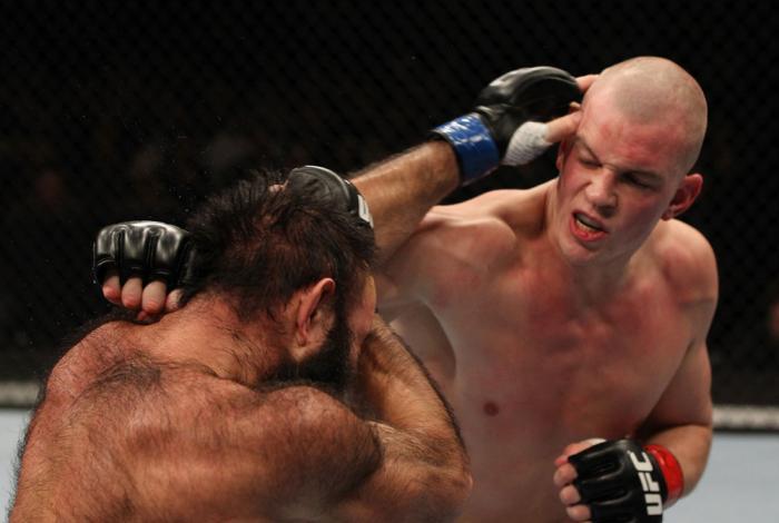 OMAHA, NE - FEBRUARY 15: (R-L) Stefan Struve punches Dave Herman during the UFC on FUEL TV event at Omaha Civic Auditorium on February 15, 2012 in Omaha, Nebraska. (Photo by Josh Hedges/Zuffa LLC/Zuffa LLC via Getty Images) *** Local Caption *** Stefan