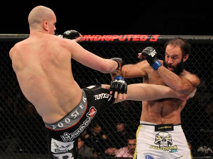 OMAHA, NE - FEBRUARY 15: (L-R) Stefan Struve kicks Dave Herman during the UFC on FUEL TV event at Omaha Civic Auditorium on February 15, 2012 in Omaha, Nebraska. (Photo by Josh Hedges/Zuffa LLC/Zuffa LLC via Getty Images) *** Local Caption *** Stefan St