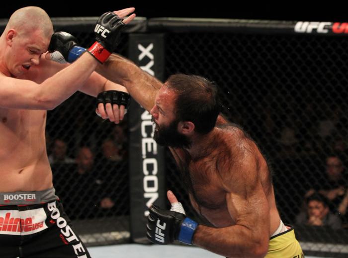 OMAHA, NE - FEBRUARY 15: (R-L) Dave Herman punches Stefan Struve during the UFC on FUEL TV event at Omaha Civic Auditorium on February 15, 2012 in Omaha, Nebraska. (Photo by Josh Hedges/Zuffa LLC/Zuffa LLC via Getty Images) *** Local Caption *** Stefan