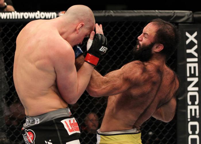 OMAHA, NE - FEBRUARY 15: (R-L) Dave Herman punches Stefan Struve during the UFC on FUEL TV event at Omaha Civic Auditorium on February 15, 2012 in Omaha, Nebraska. (Photo by Josh Hedges/Zuffa LLC/Zuffa LLC via Getty Images) *** Local Caption *** Stefan