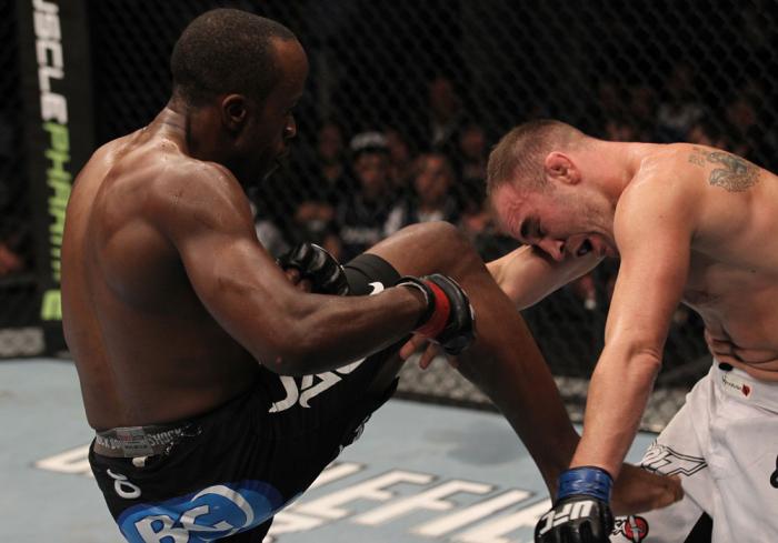 TORONTO, ON - DECEMBER 10: (L-R) Claude Patrick delivers a knee strike against Brian Ebersole during the UFC 140 event at Air Canada Centre on December 10, 2011 in Toronto, Ontario, Canada. (Photo by Nick Laham/Zuffa LLC/Zuffa LLC via Getty Images)
