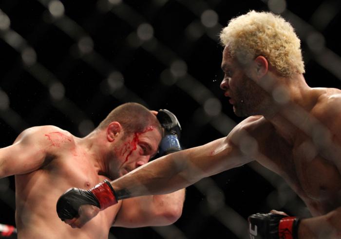 LAS VEGAS, NV - FEBRUARY 04: Josh Koscheck (right) punches Mike Pierce during the UFC 143 event at Mandalay Bay Events Center on February 4, 2012 in Las Vegas, Nevada. (Photo by Josh Hedges/Zuffa LLC/Zuffa LLC via Getty Images) *** Local Caption *** Jos