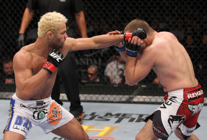 LAS VEGAS, NV - FEBRUARY 04: Josh Koscheck (left) punches Mike Pierce during the UFC 143 event at Mandalay Bay Events Center on February 4, 2012 in Las Vegas, Nevada. (Photo by Nick Laham/Zuffa LLC/Zuffa LLC via Getty Images) *** Local Caption *** Josh