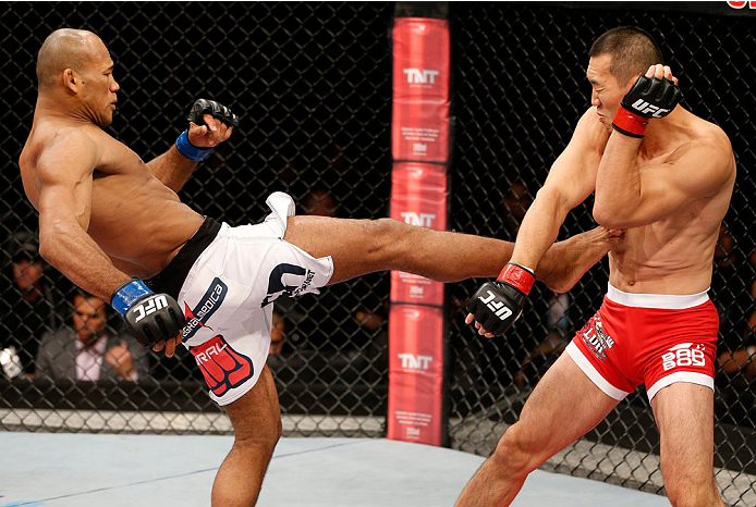 BELO HORIZONTE, BRAZIL - SEPTEMBER 04: (L-R) Ronaldo "Jacare" Souza kicks Yushin Okami in their middleweight fight during the UFC on FOX Sports 1 event at Mineirinho Arena on September 4, 2013 in Belo Horizonte, Brazil. (Photo by Josh Hedges/Zuffa LLC/Zu