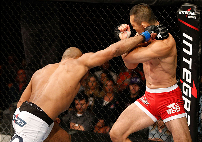 BELO HORIZONTE, BRAZIL - SEPTEMBER 04: (L-R) Ronaldo "Jacare" Souza punches Yushin Okami in their middleweight fight during the UFC on FOX Sports 1 event at Mineirinho Arena on September 4, 2013 in Belo Horizonte, Brazil. (Photo by Josh Hedges/Zuffa LLC/