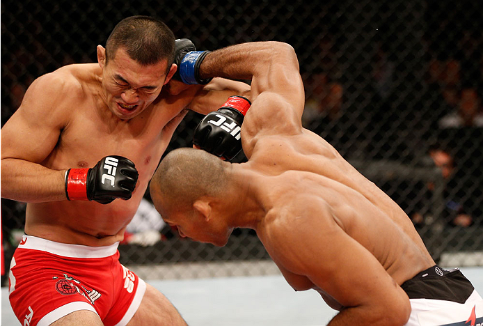 BELO HORIZONTE, BRAZIL - SEPTEMBER 04: (R-L) Ronaldo "Jacare" Souza punches Yushin Okami in their middleweight fight during the UFC on FOX Sports 1 event at Mineirinho Arena on September 4, 2013 in Belo Horizonte, Brazil. (Photo by Josh Hedges/Zuffa LLC/