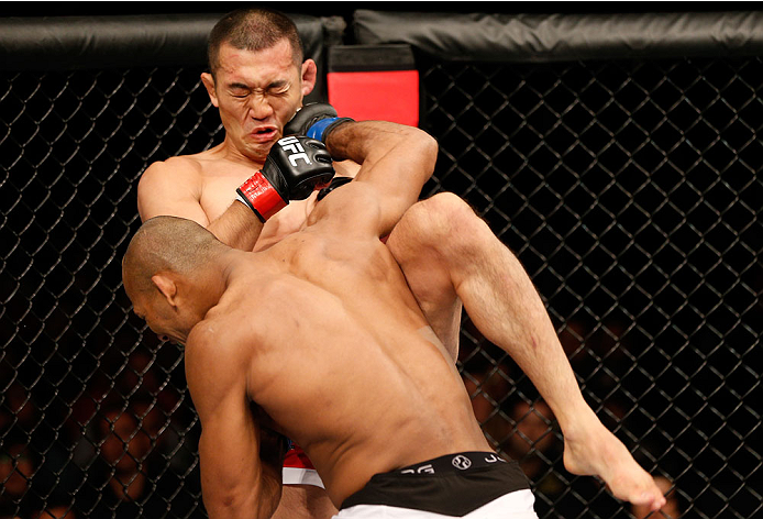 BELO HORIZONTE, BRAZIL - SEPTEMBER 04: (L-R) Ronaldo "Jacare" Souza knocks out Yushin Okami with a punch in their middleweight fight during the UFC on FOX Sports 1 event at Mineirinho Arena on September 4, 2013 in Belo Horizonte, Brazil. (Photo by Josh H