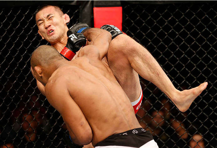 BELO HORIZONTE, BRAZIL - SEPTEMBER 04: (L-R) Ronaldo "Jacare" Souza knocks out Yushin Okami with a punch in their middleweight fight during the UFC on FOX Sports 1 event at Mineirinho Arena on September 4, 2013 in Belo Horizonte, Brazil. (Photo by Josh H