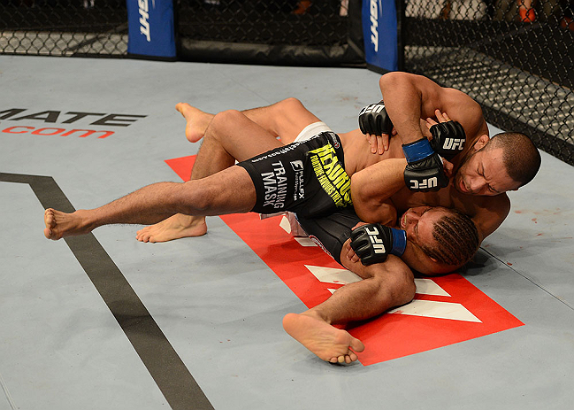 ANAHEIM, CA - FEBRUARY 23: Ivan Menjivar (black shorts) slams Urijah Faber in their bantamweight bout during UFC 157 at Honda Center on February 23, 2013 in Anaheim, California. (Photo by Donald Miralle/Zuffa LLC/Zuffa LLC via Getty Images) *** Local Ca