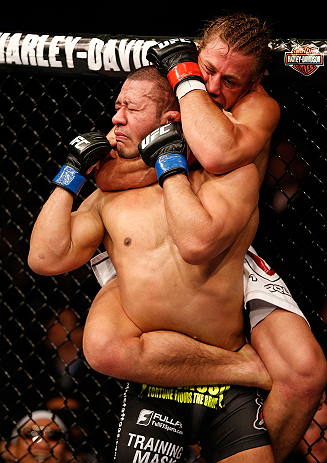 ANAHEIM, CA - FEBRUARY 23: Urijah Faber (right) attempts to submit Ivan Menjivar in their bantamweight bout during UFC 157 at Honda Center on February 23, 2013 in Anaheim, California. (Photo by Josh Hedges/Zuffa LLC/Zuffa LLC via Getty Images) *** Local