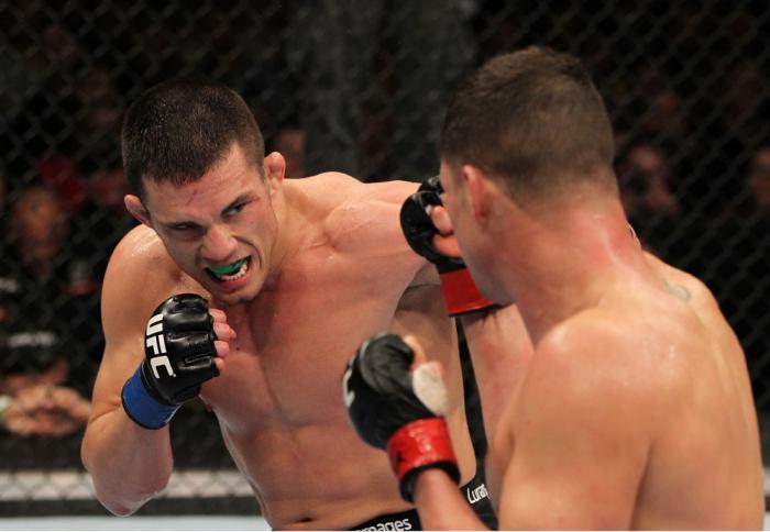 OMAHA, NE - FEBRUARY 15: (L-R) Jake Ellenberger punches Diego Sanchez during the UFC on FUEL TV event at Omaha Civic Auditorium on February 15, 2012 in Omaha, Nebraska. (Photo by Josh Hedges/Zuffa LLC/Zuffa LLC via Getty Images) *** Local Caption *** Ja