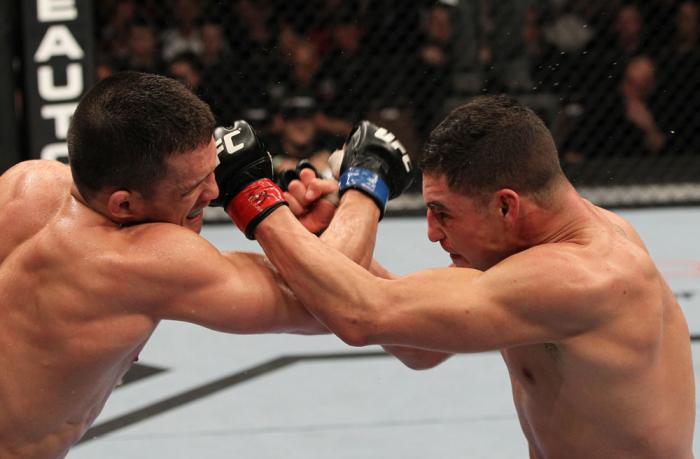 OMAHA, NE - FEBRUARY 15: (L-R) Jake Ellenberger and Diego Sanchez trade punches during the UFC on FUEL TV event at Omaha Civic Auditorium on February 15, 2012 in Omaha, Nebraska. (Photo by Josh Hedges/Zuffa LLC/Zuffa LLC via Getty Images) *** Local Capt