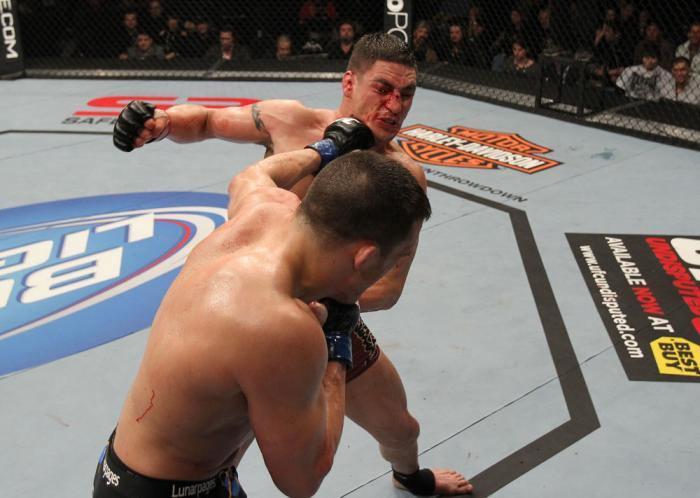 OMAHA, NE - FEBRUARY 15: (R-L) Jake Ellenberger punches Diego Sanchez during the UFC on FUEL TV event at Omaha Civic Auditorium on February 15, 2012 in Omaha, Nebraska. (Photo by Josh Hedges/Zuffa LLC/Zuffa LLC via Getty Images) *** Local Caption *** Ja